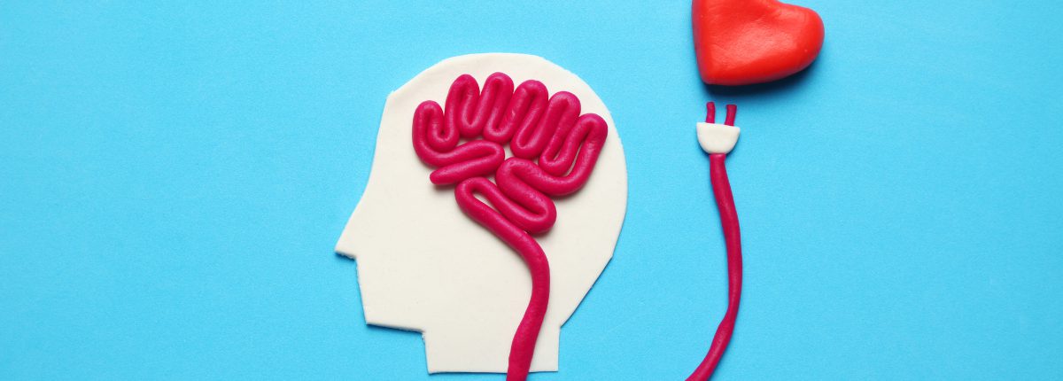 Figure of man with brain and red heart. Love and intelligence